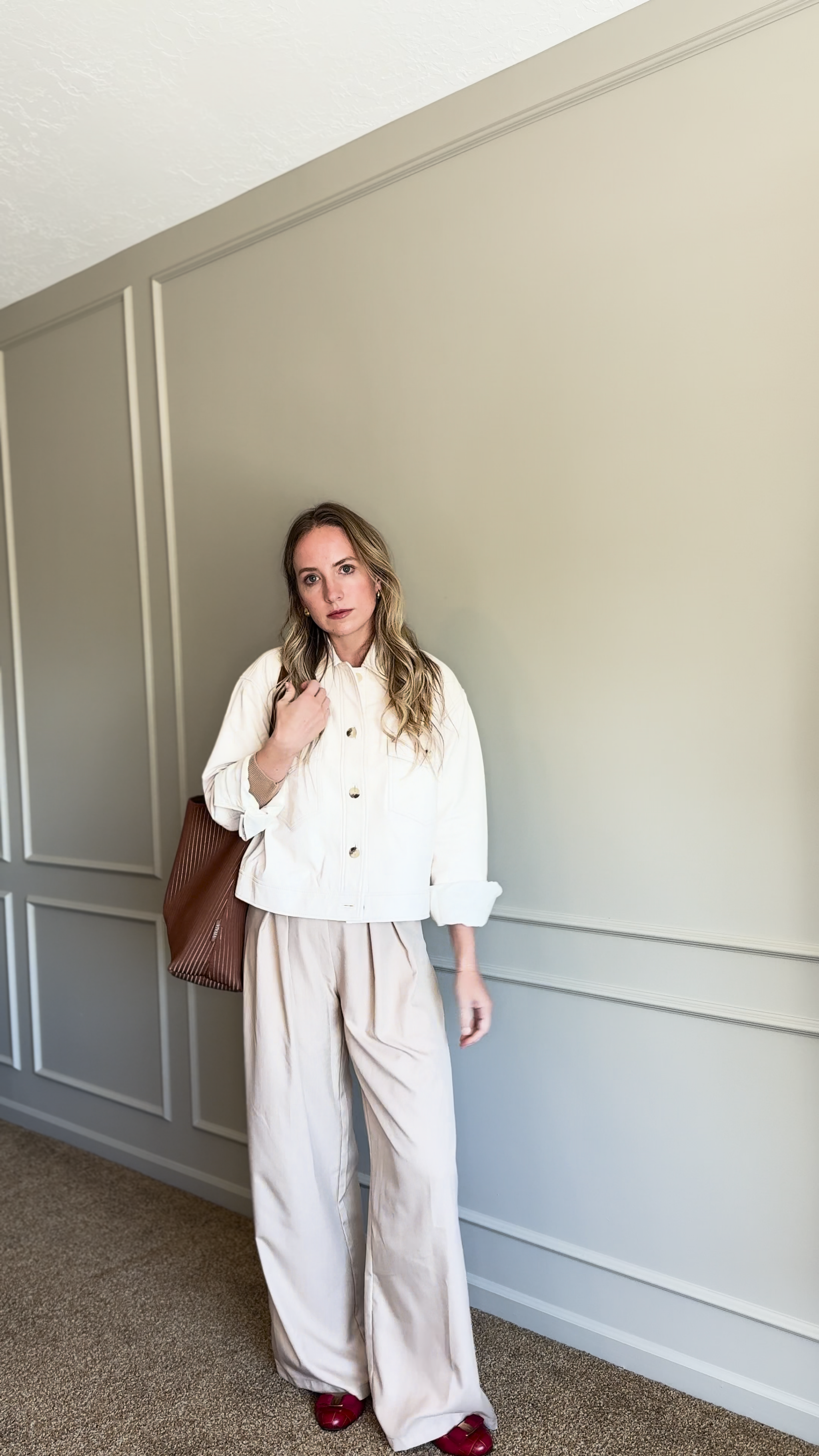 quince cream leather cropped jacket styled with trousers for a review.