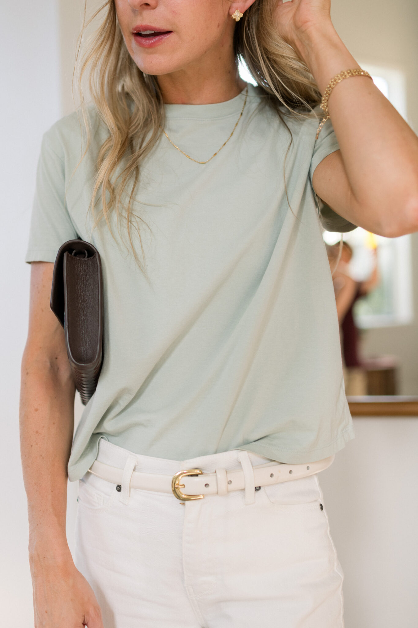 Mott & Bow Everyday Cotton Crew Tee in Honeydew tucked into Bone Mercer cropped jeans with a cream belt